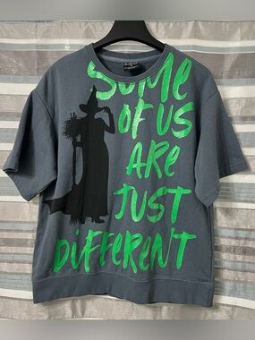 Universal Studios Wicked “Some of Us Are Just Different” Short Sleeve Crew Top